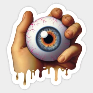 Hand holding an Eyeball Sticker